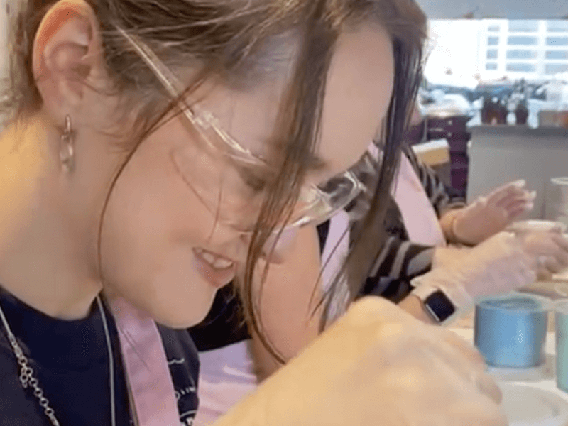 Girl making a resin art plant pot